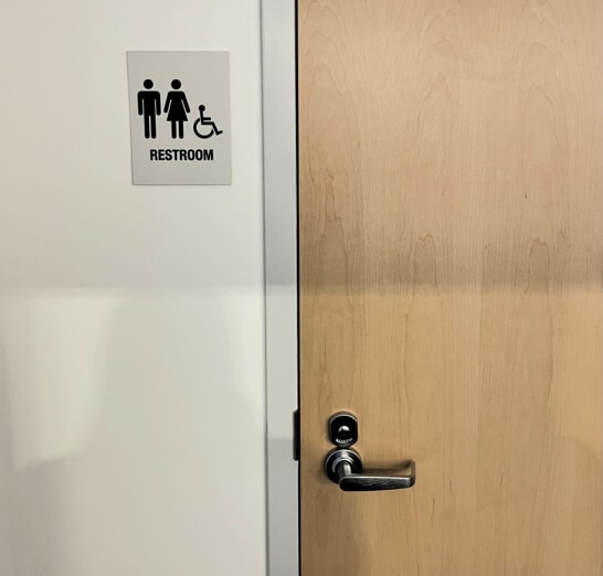 JU Basketball Facility restroom ADA sign